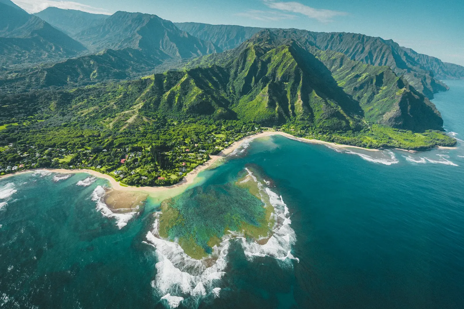 Pacific surf meeting Hawaii’s green coastline